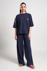 Delma – LaRosa Night Wears for Women – Cotton Summer Sets Collection | Larosawears | Shop Online – Front View.
Women wearing a navy blue outfit with a logo on a white background